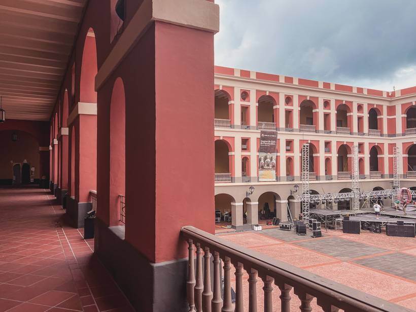Pink walls and courtyard within the Las Americas Museum during an Old San Juan itinerary
